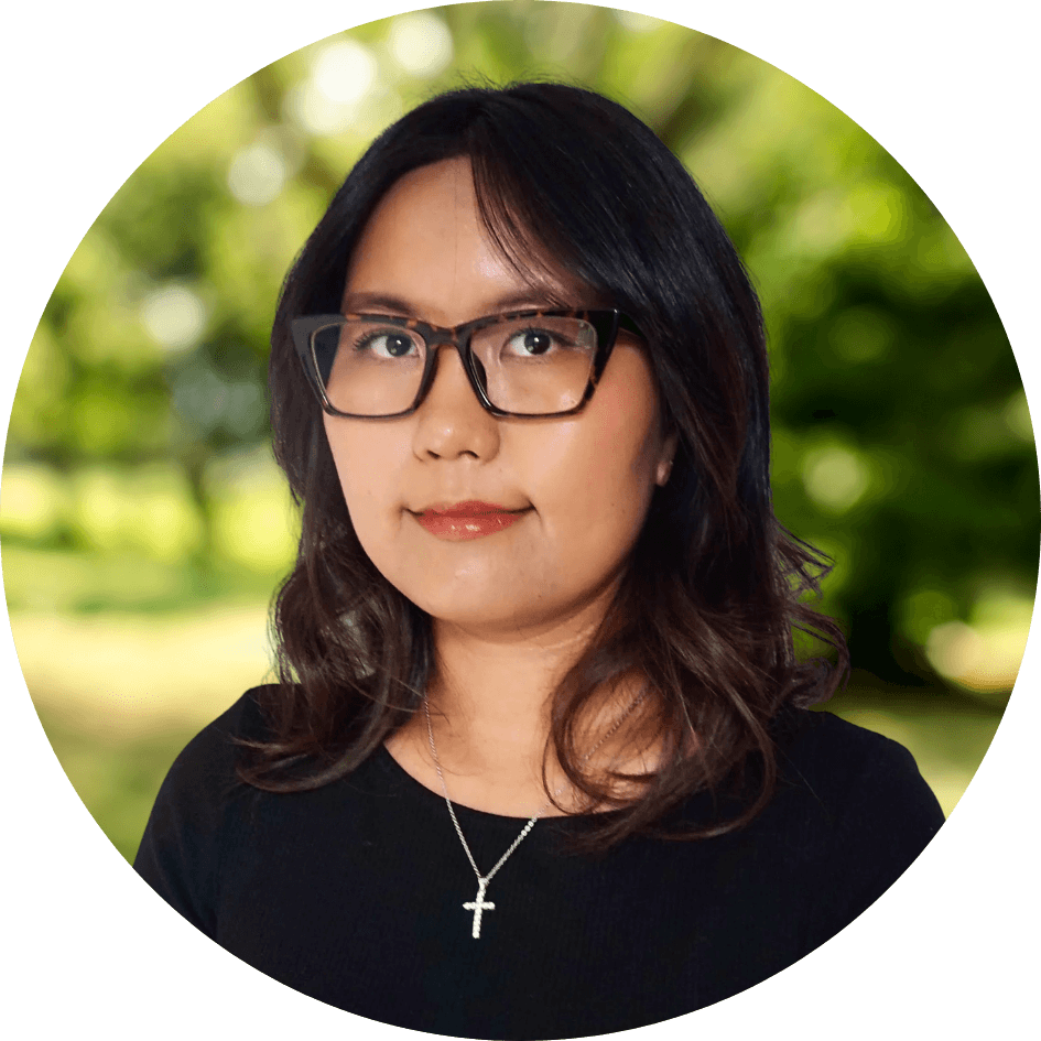 Counselor Alice Sainjargal smiles kindly in front of a nature background