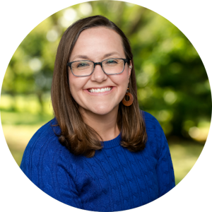 Counselor Andi Anderson smiles in front of a nature background