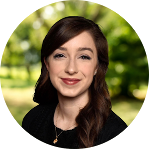 Counselor Anna Graumann smiles kindly in front of a nature background