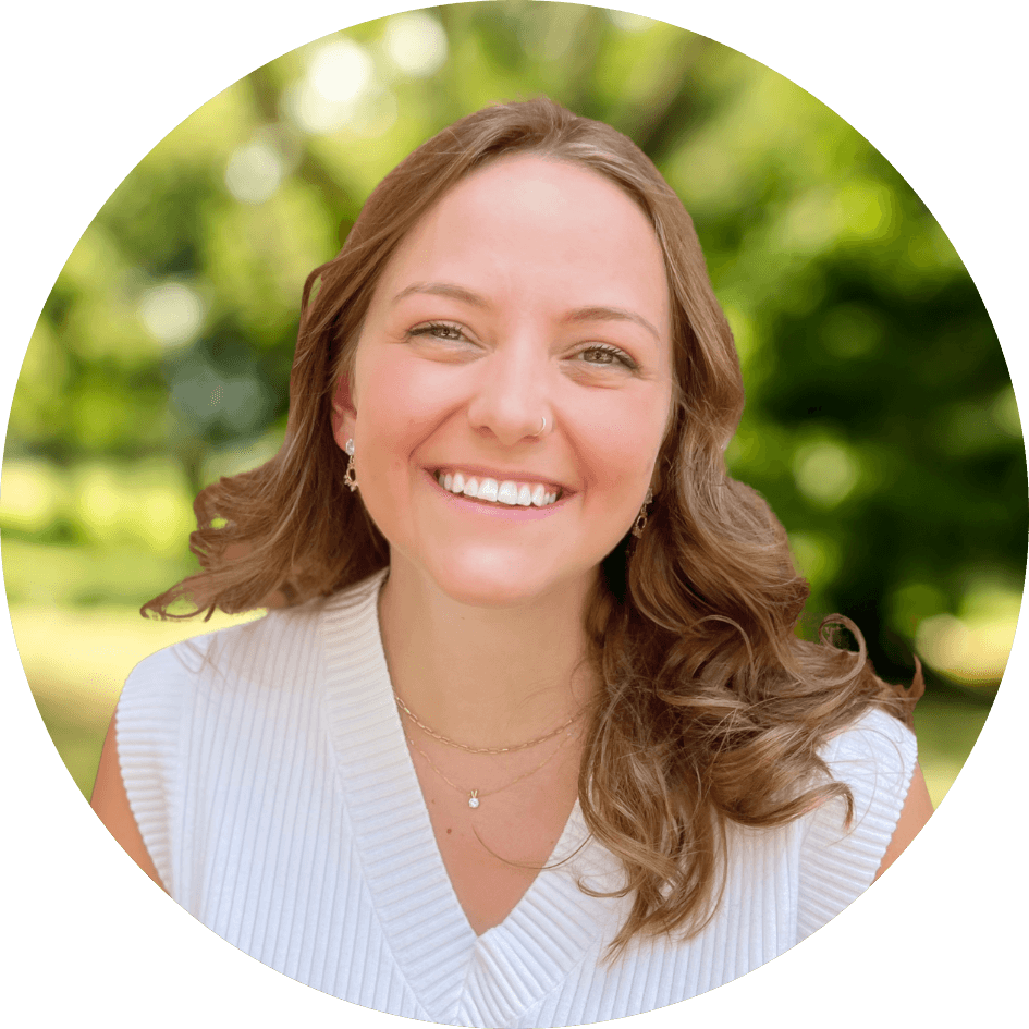 Counselor Audrey Wieske smiles brightly in front of a nature background