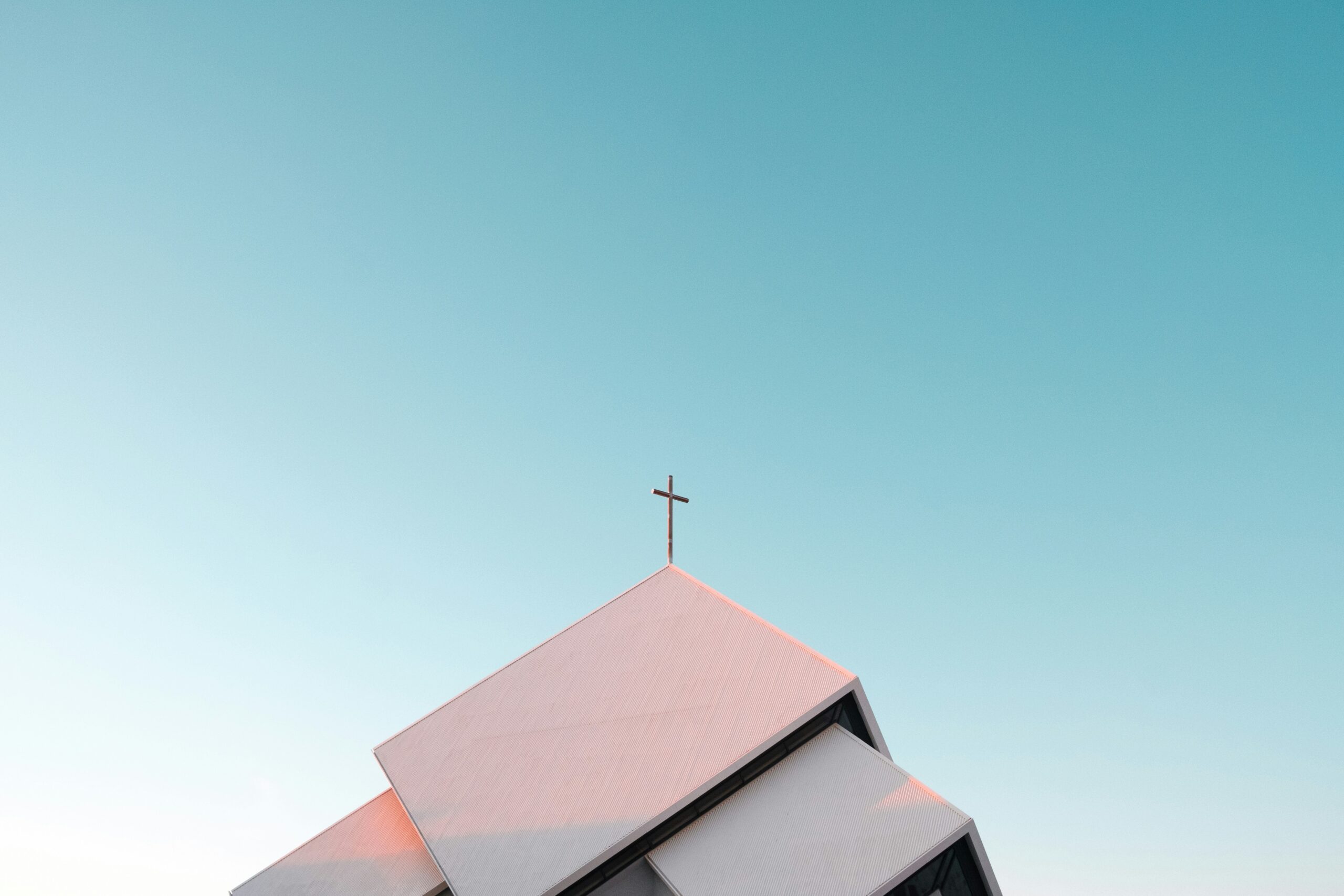 Picture of a church steeple set against a blue sky