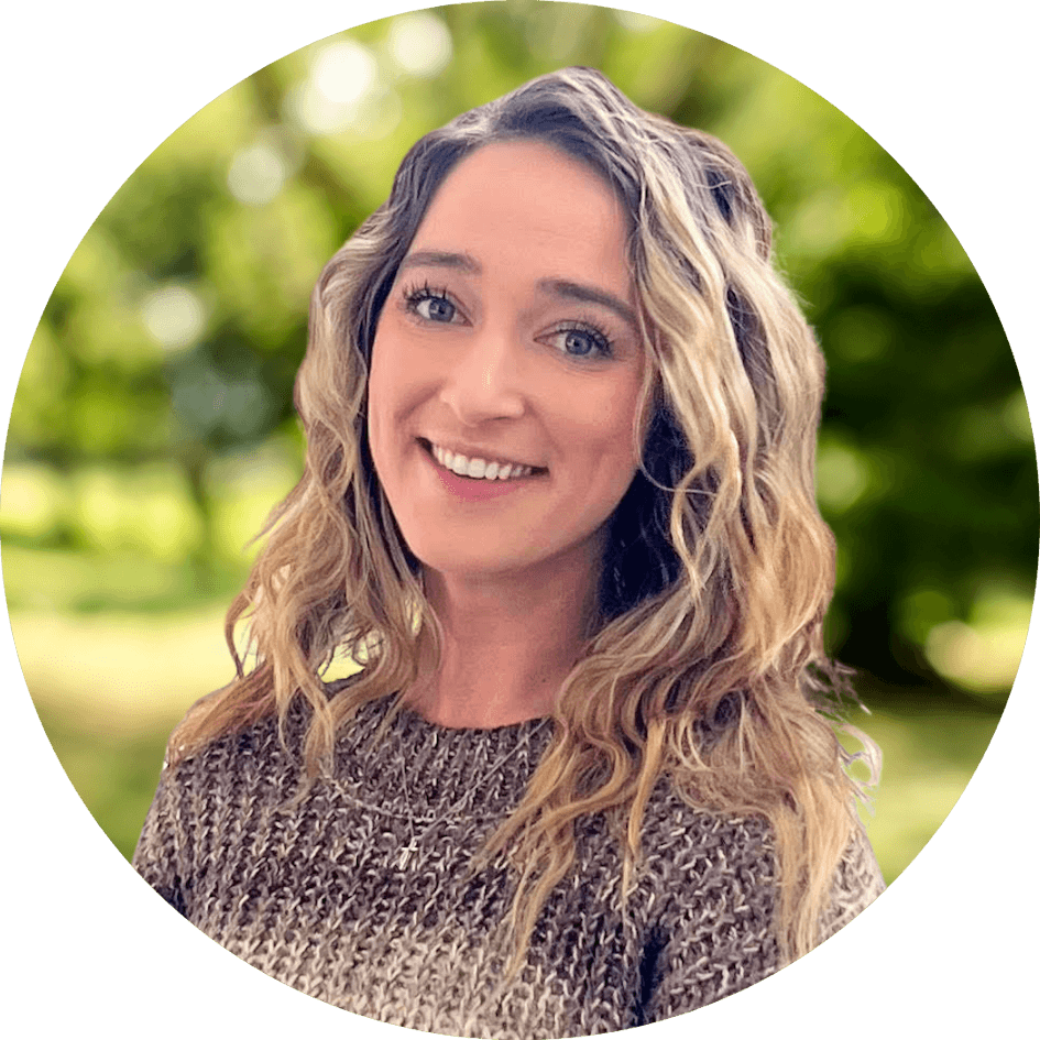 Erin Coughlin headshot in front of a green nature background