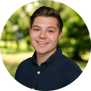 Counselor Lucas Bishop smiles in front of a nature background