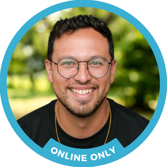 Counselor Matthew Bacchus smiles brightly in front of a nature background
