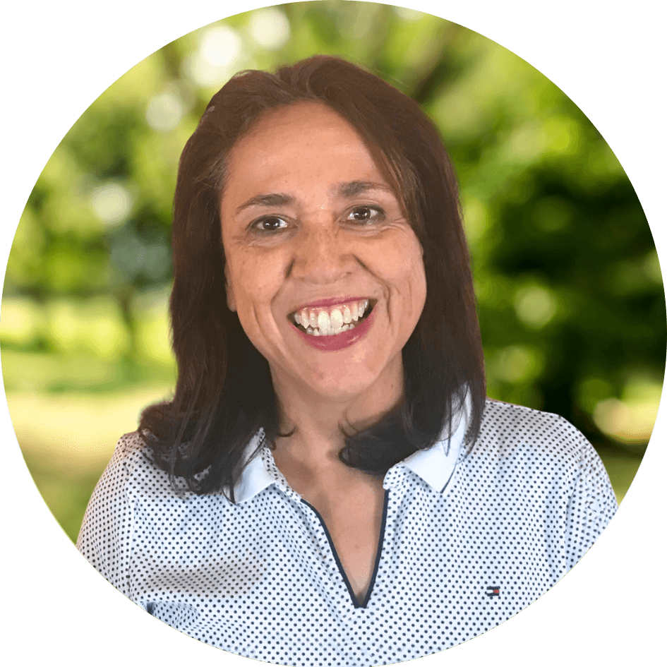 Counselor Yvette Gonzalez smiles in front of a nature background